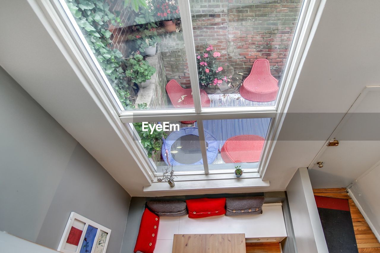 High angle view of furniture by window at home