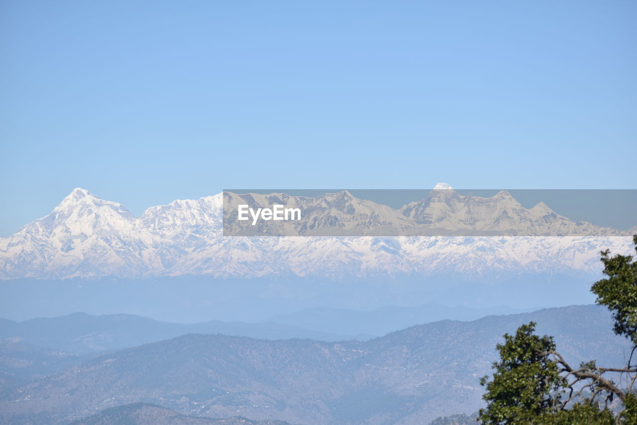 SNOWCAPPED MOUNTAINS AGAINST CLEAR SKY