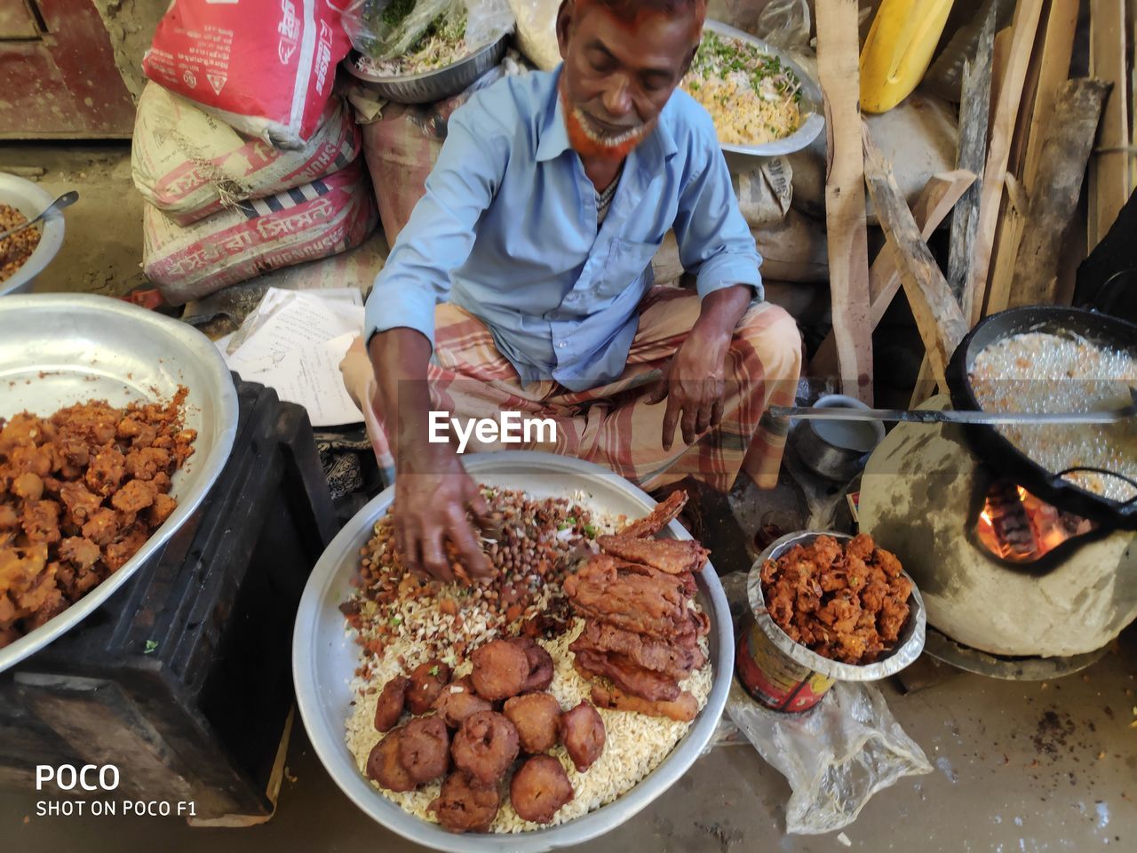 HIGH ANGLE VIEW OF WOMAN PREPARING FOOD