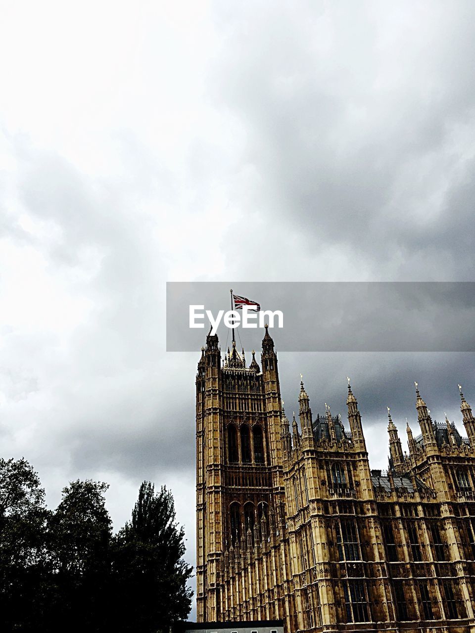 Low angle view of building against cloudy sky