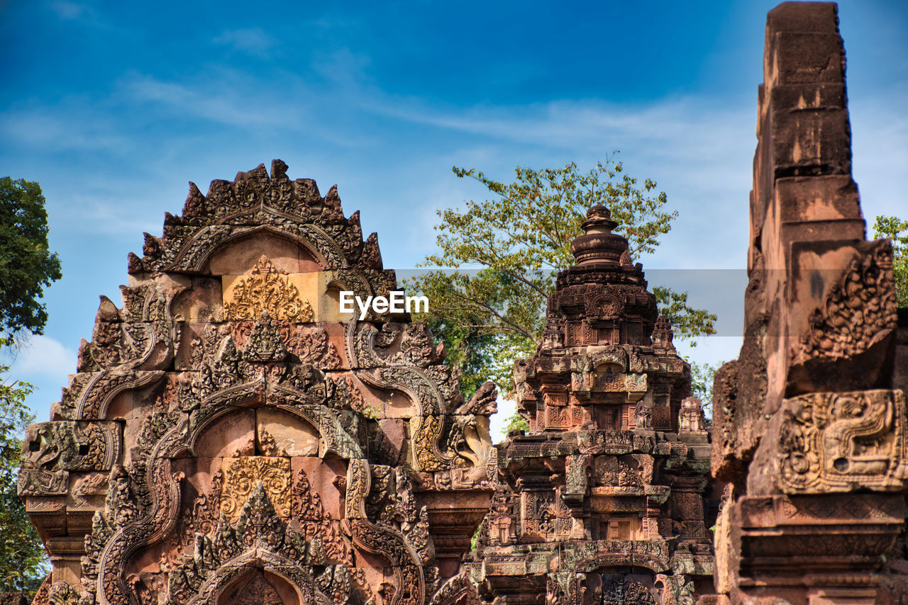 Banteay srei or banteay srey temple site among the ancient ruins of angkor wat hindu temple complex