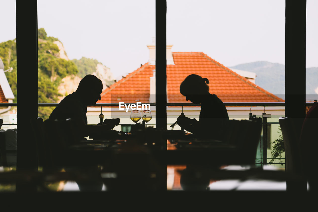 SILHOUETTE PEOPLE AT RESTAURANT