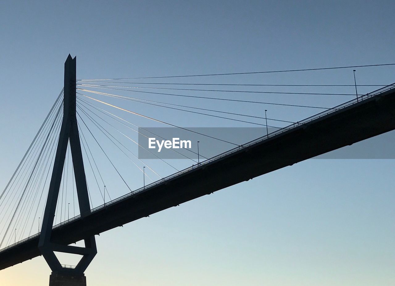 LOW ANGLE VIEW OF SUSPENSION BRIDGE