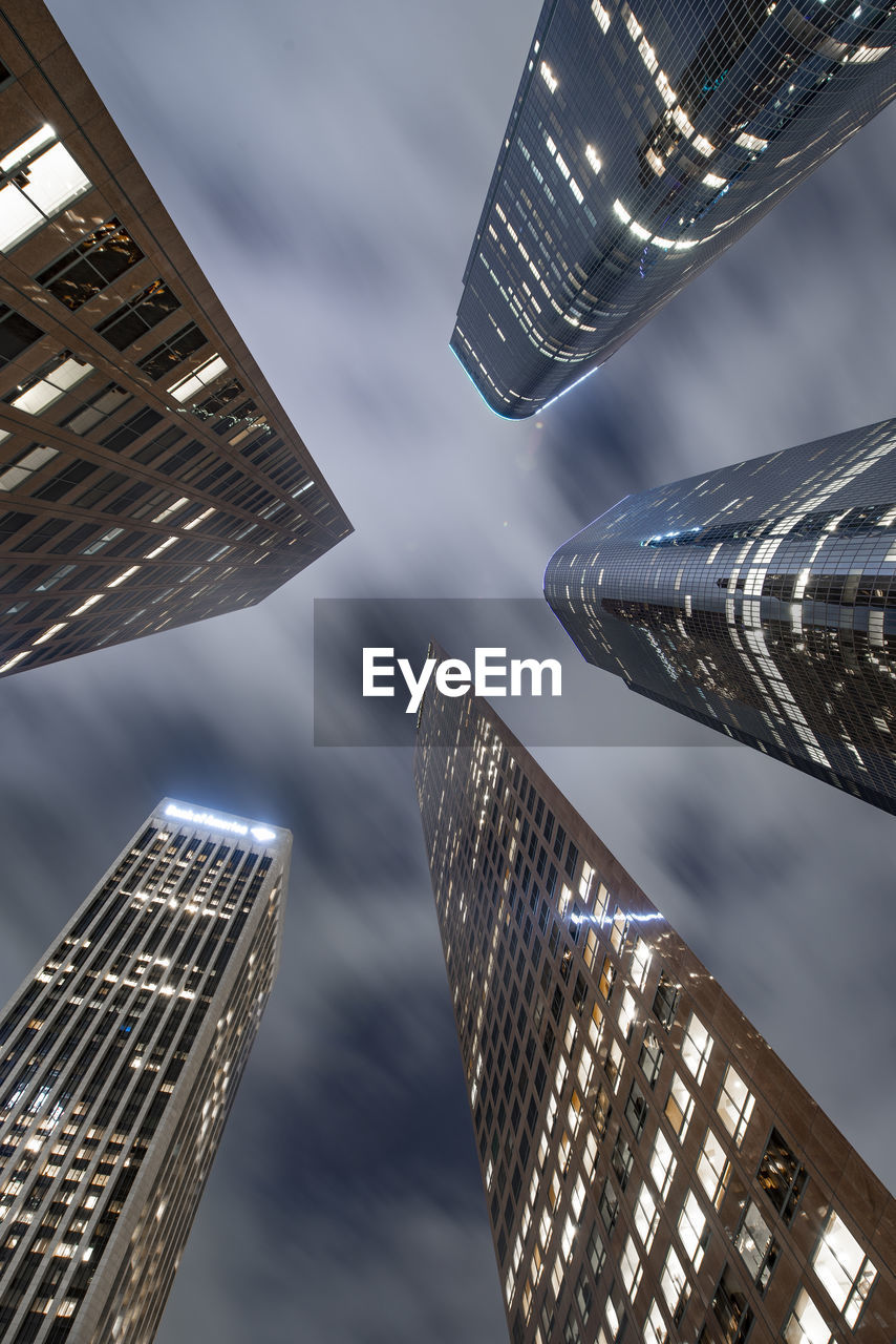 Looking up at skyscrapers in downtown los angeles at night