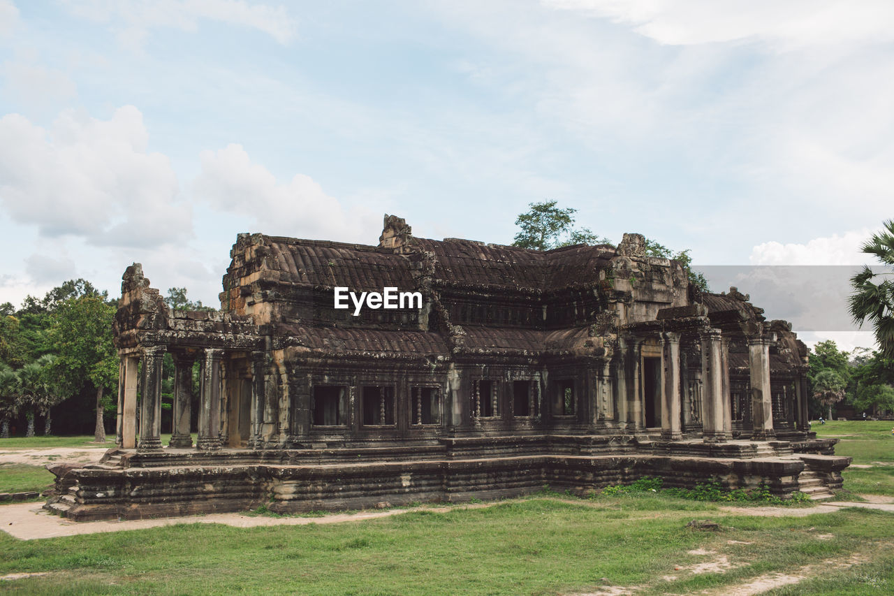 Old temple against cloudy sky