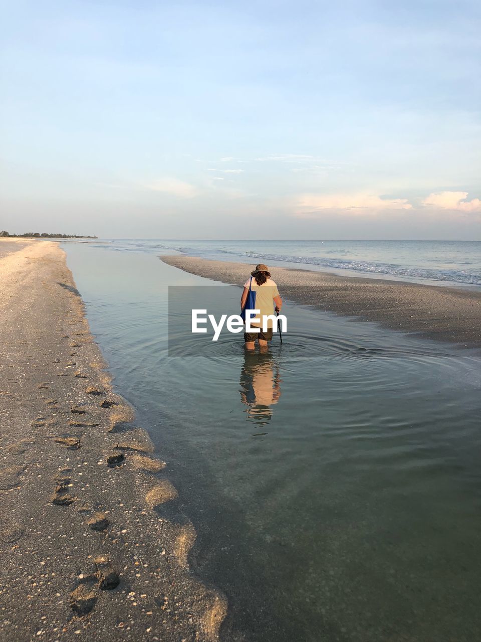 Rear view of woman at beach