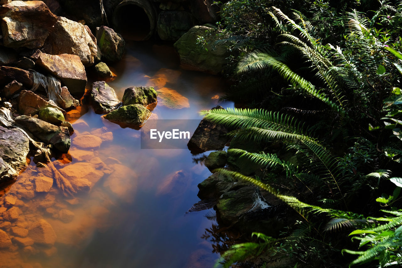 Scenic view of rocks against sky during sunset