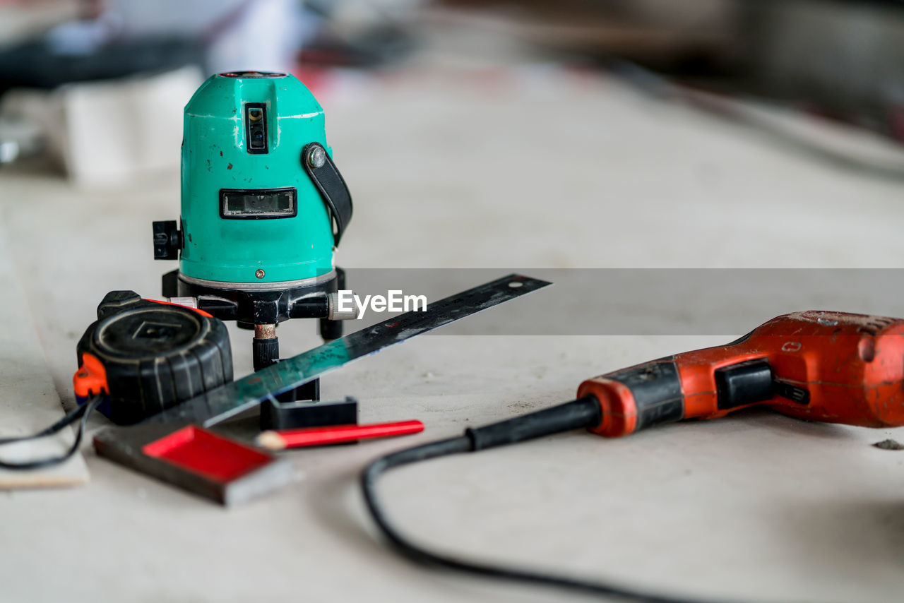 Close-up of work tools on workbench at factory