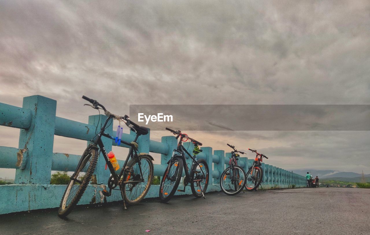 transportation, sky, bicycle, cloud, vehicle, nature, mode of transportation, no people, water, architecture, travel, outdoors, environment, in a row, land, beach, city, travel destinations, day, road, sea