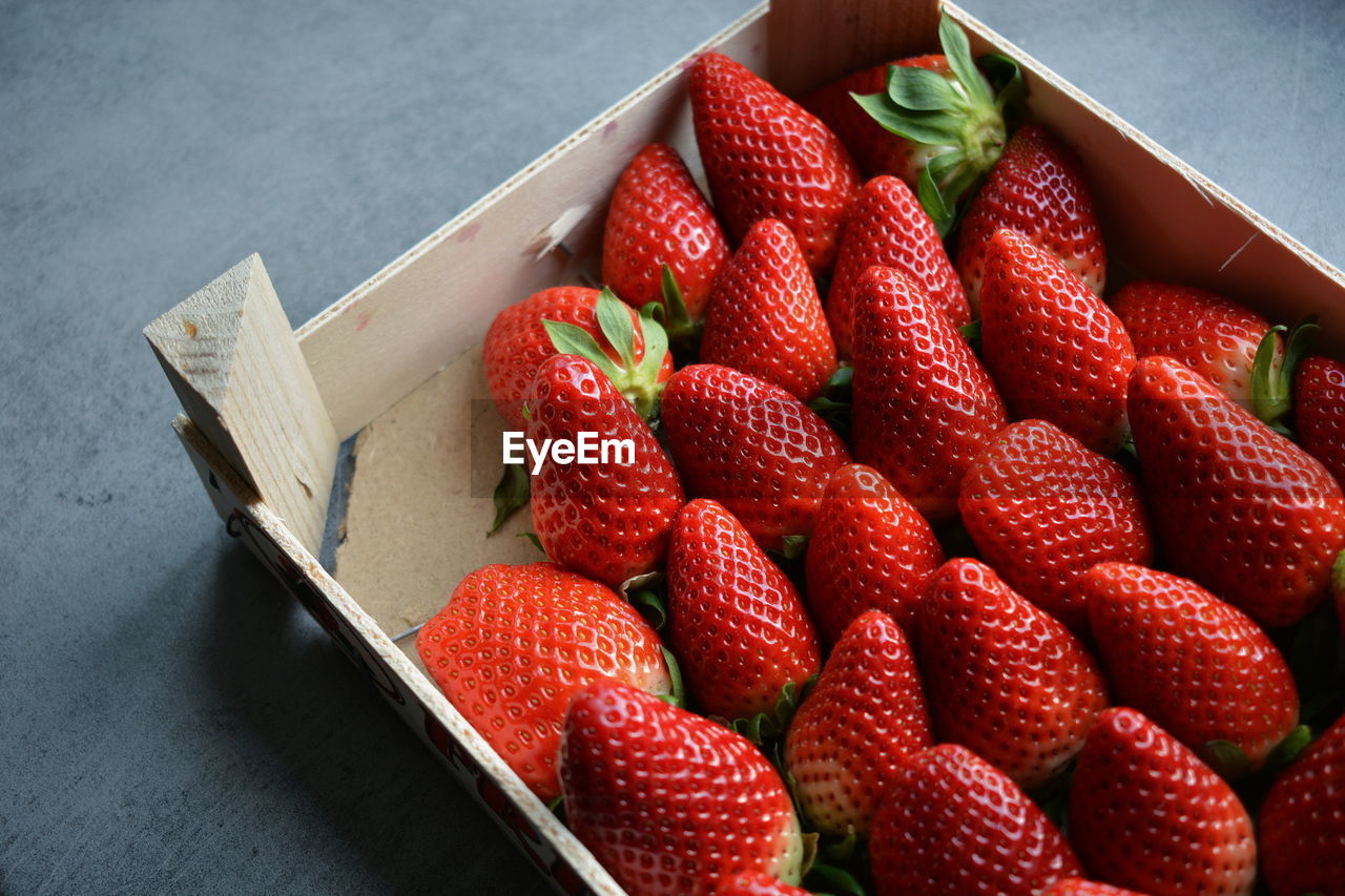 High angle view of strawberries in crate