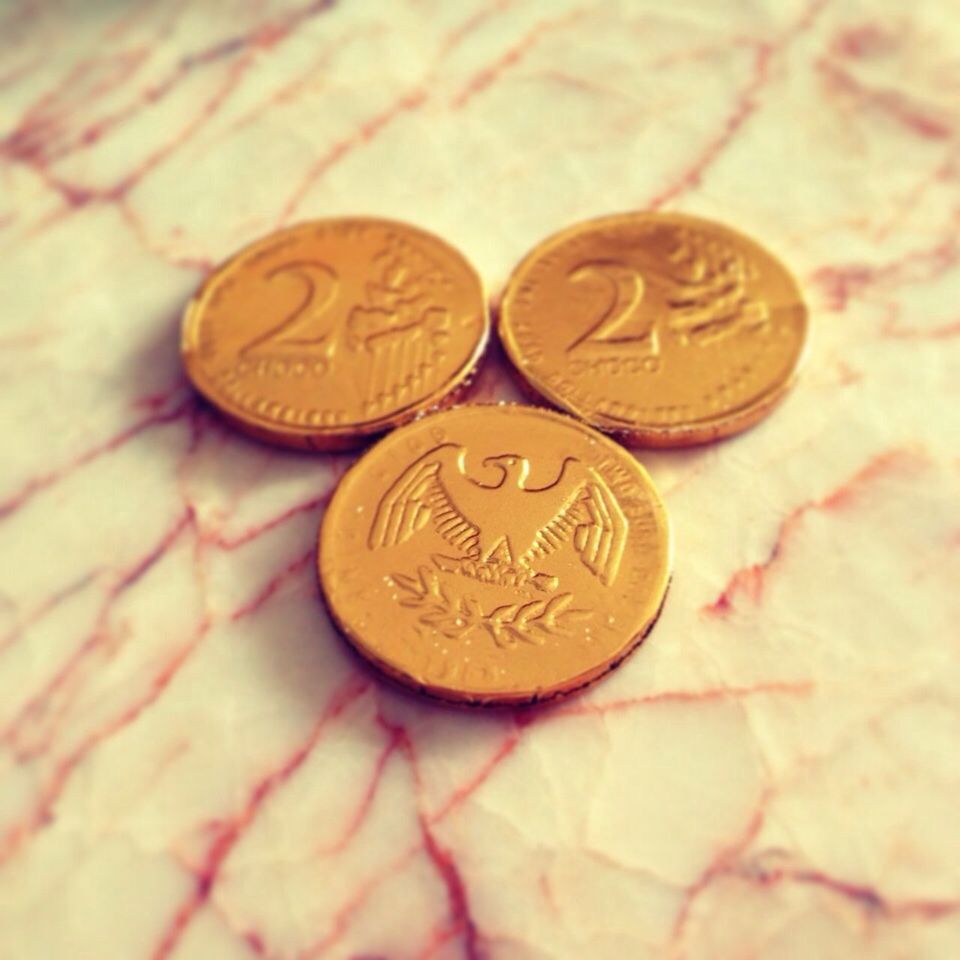 Close-up of copper coins on floor