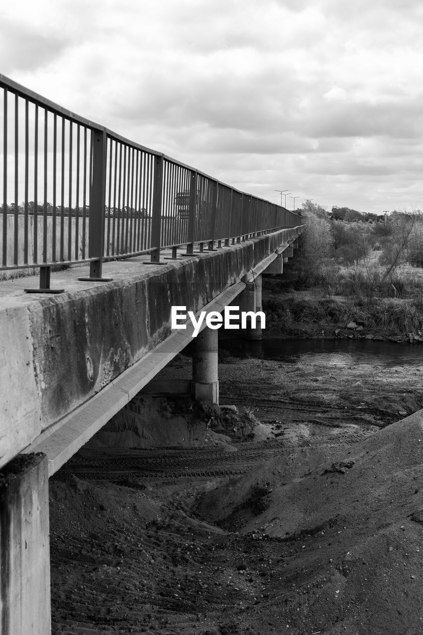 VIEW OF BRIDGE OVER WATER AGAINST SKY