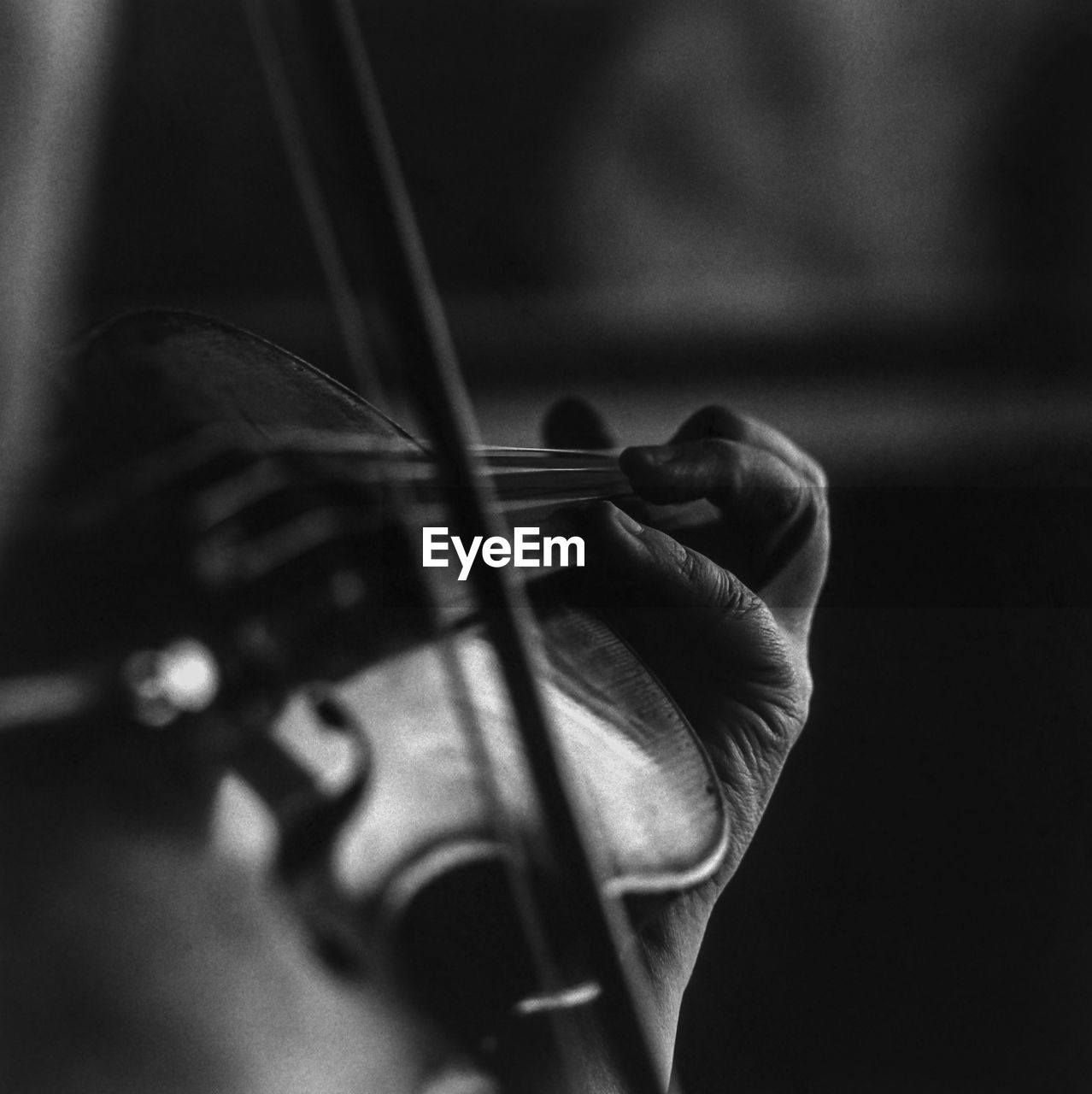 Close-up of hand playing violin