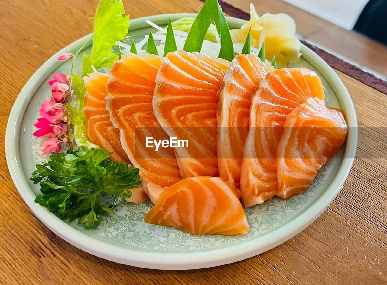 food, food and drink, garnish, healthy eating, seafood, freshness, japanese food, plate, fish, wellbeing, asian food, salmon, dish, culture, no people, cuisine, indoors, meal, raw food, table, appetizer, serving size, rice, high angle view, vegetable, orange color, produce, meat, japanese cuisine, slice, sushi