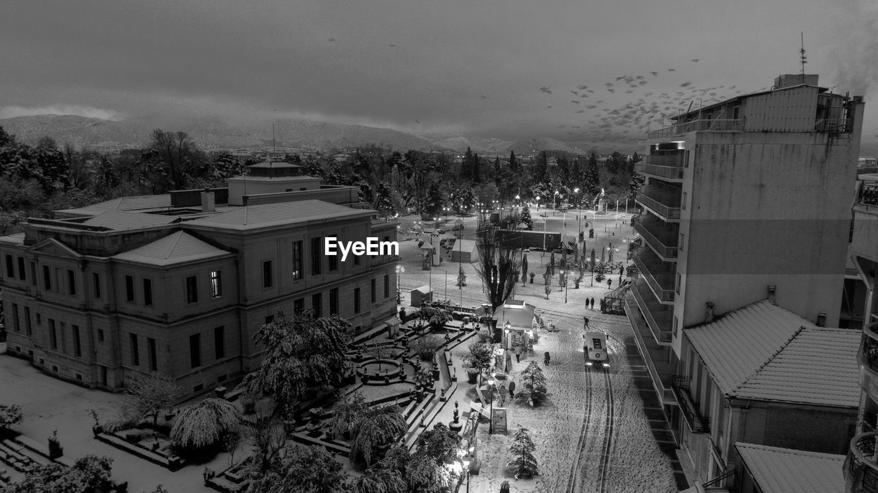 HIGH ANGLE VIEW OF BUILDINGS AGAINST SKY