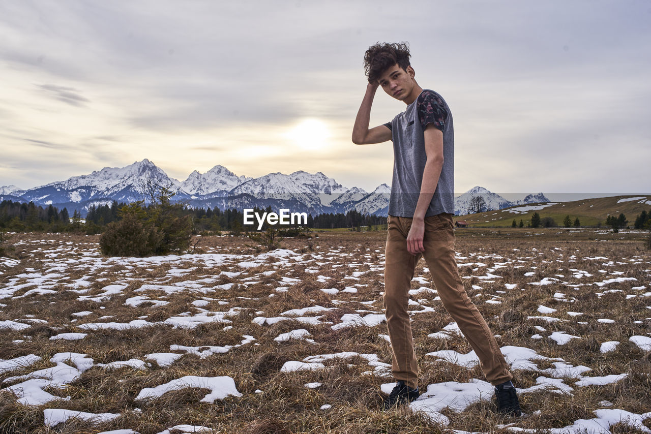 Man standing on field during winter