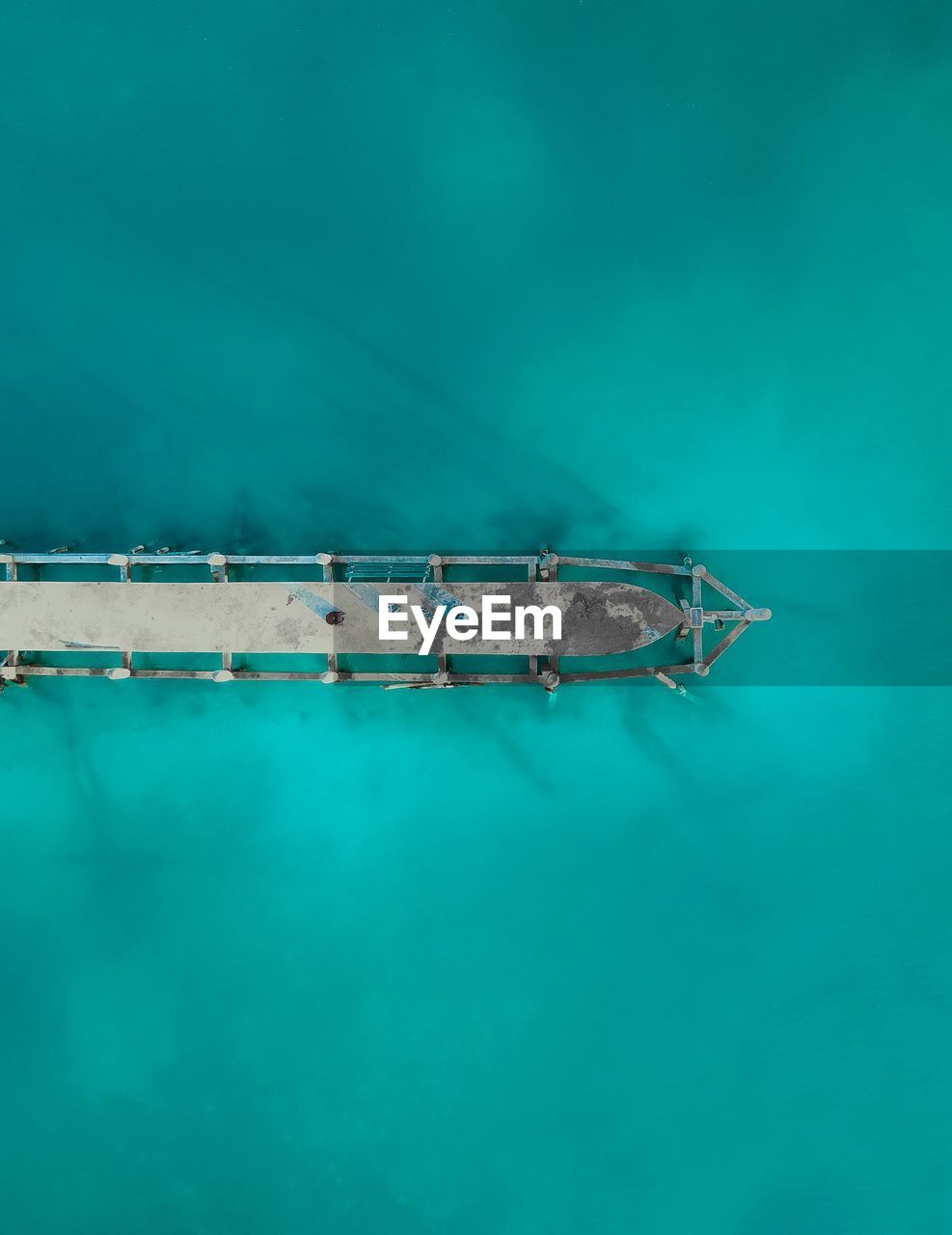 Droneshot of a jetty with turquoise water which is located at koh rong sanloem, cambodia.