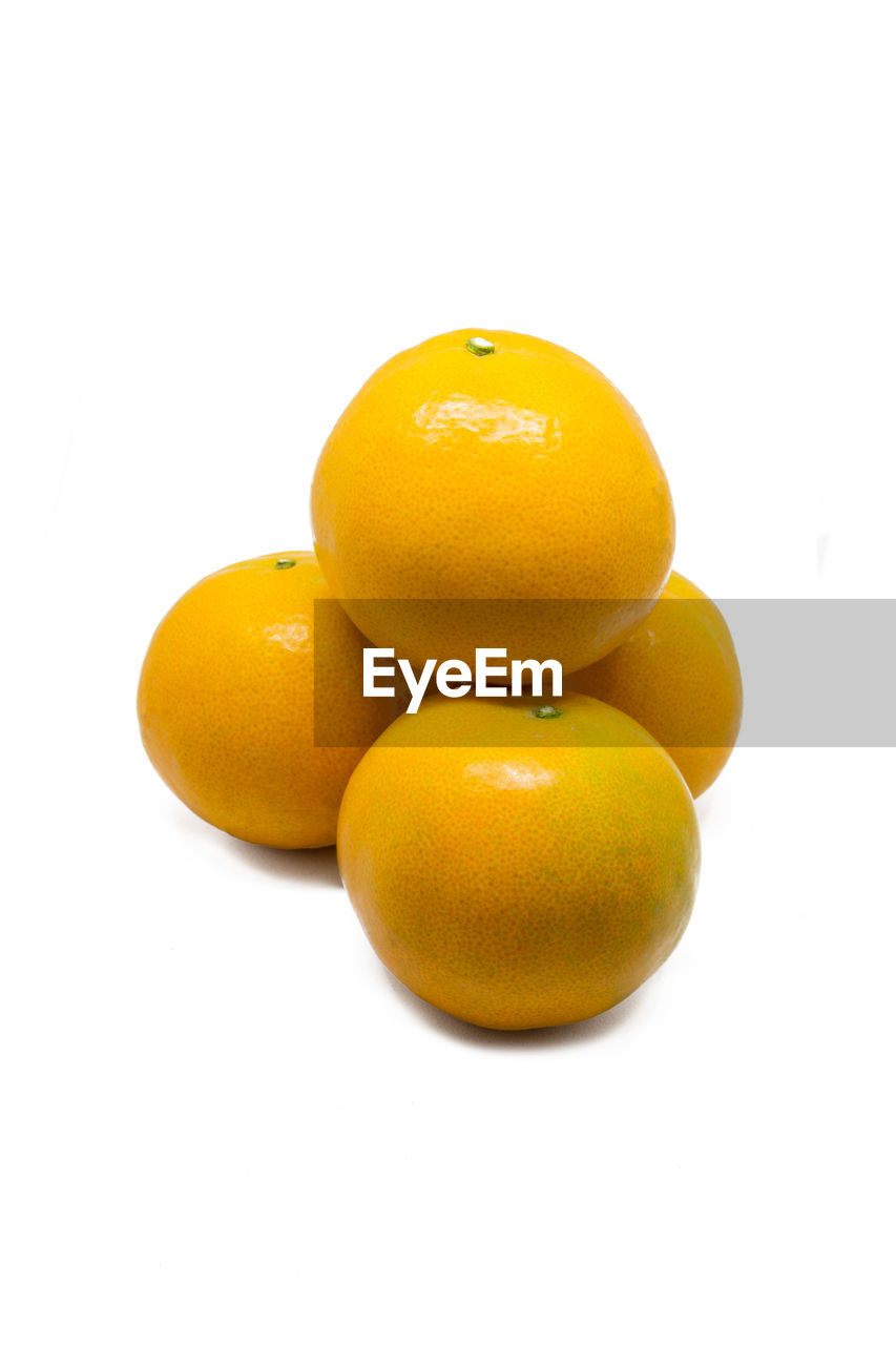 Close-up of oranges against white background