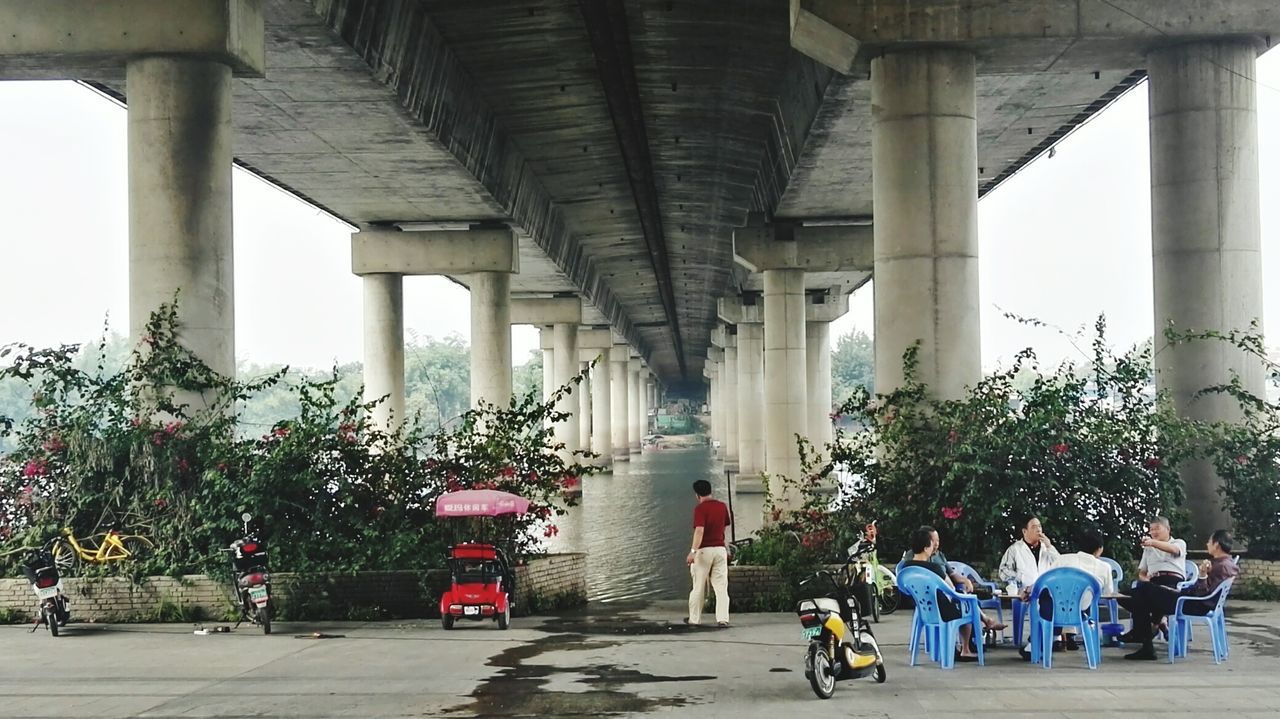 PEOPLE WALKING ON BRIDGE