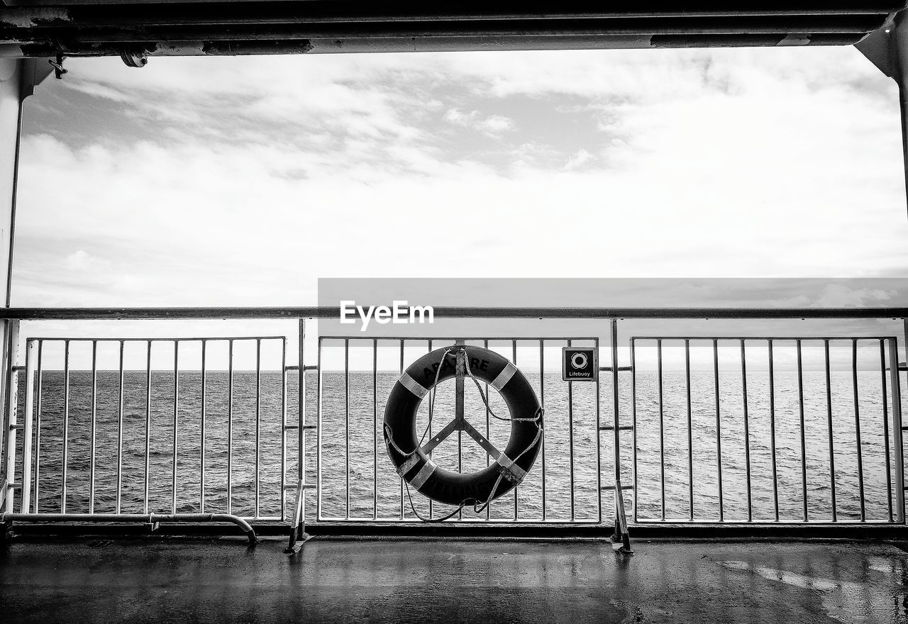 Life belt tied on railing of boat