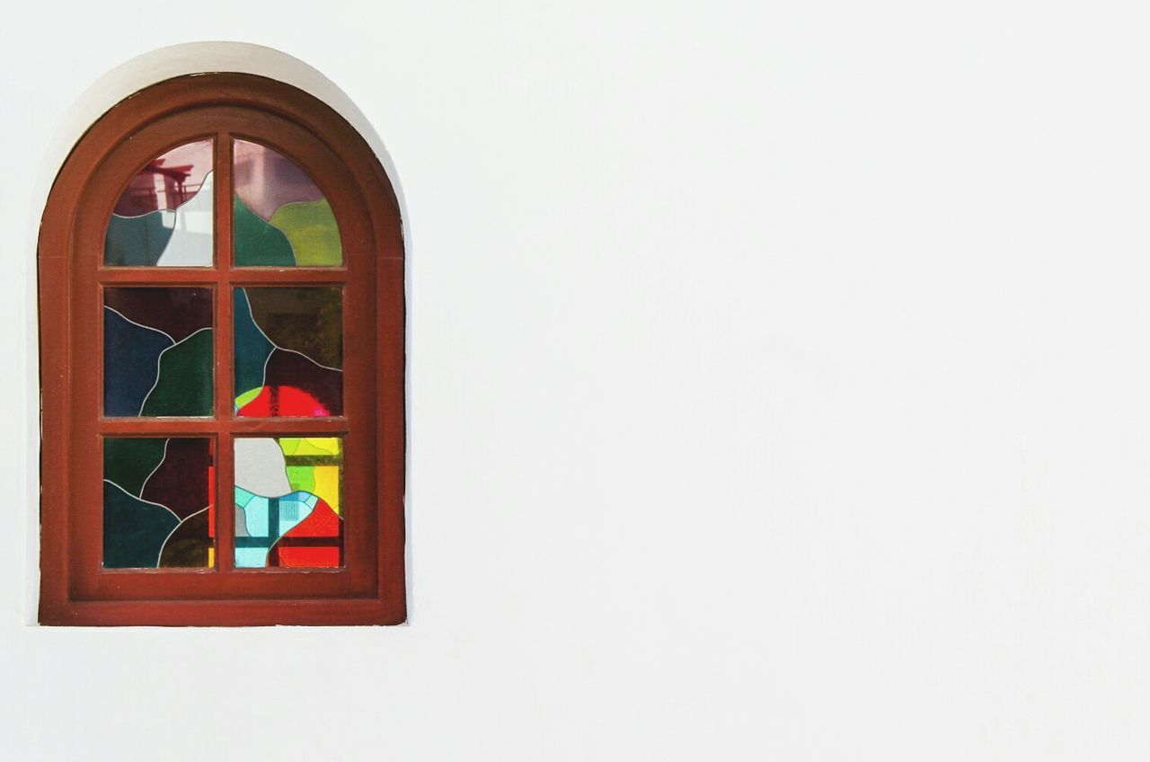 LOW ANGLE VIEW OF WINDOW ON WHITE WALL