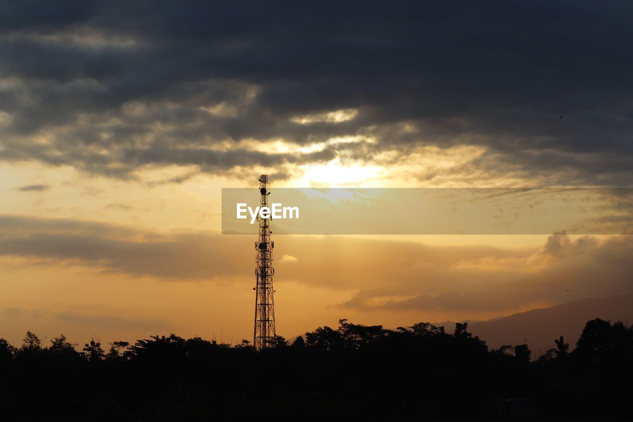 SILHOUETTE OF TOWER AGAINST SKY DURING SUNSET