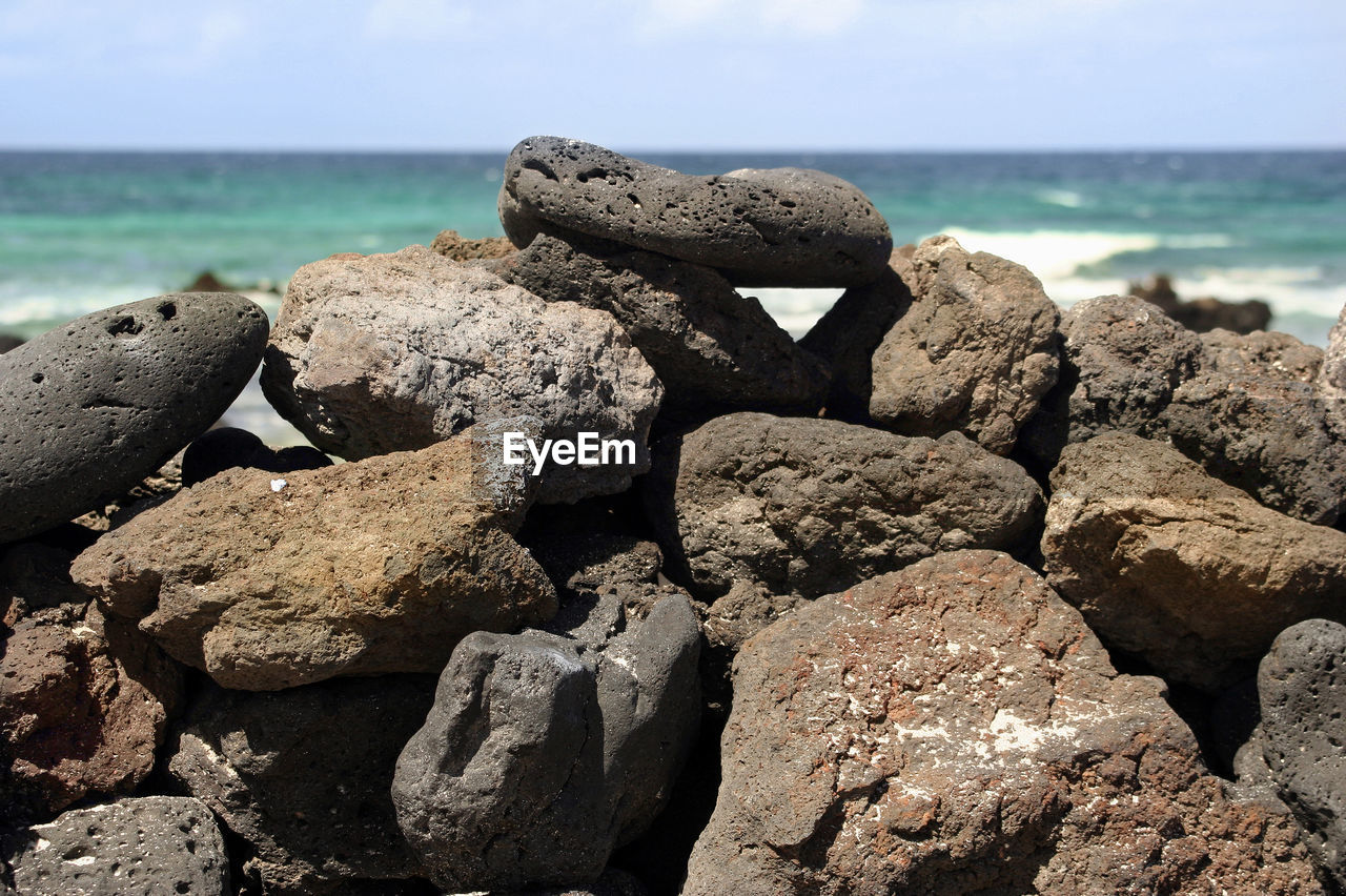 ROCKS ON SHORE AT BEACH