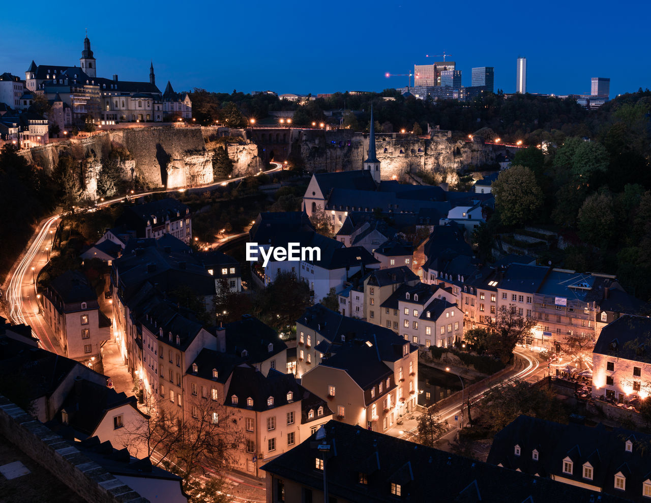 High angle view of illuminated buildings in city at night