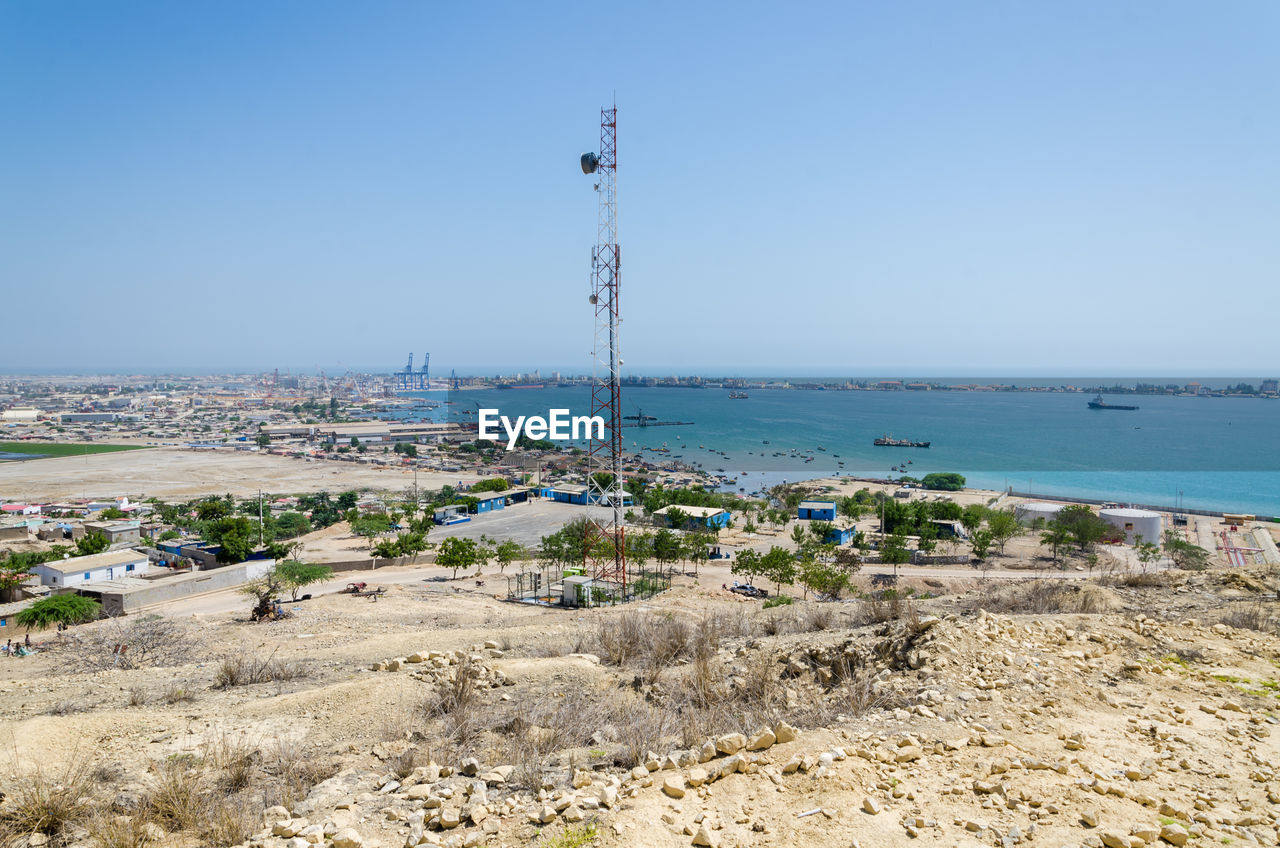 Scenic view of beach against clear blue sky