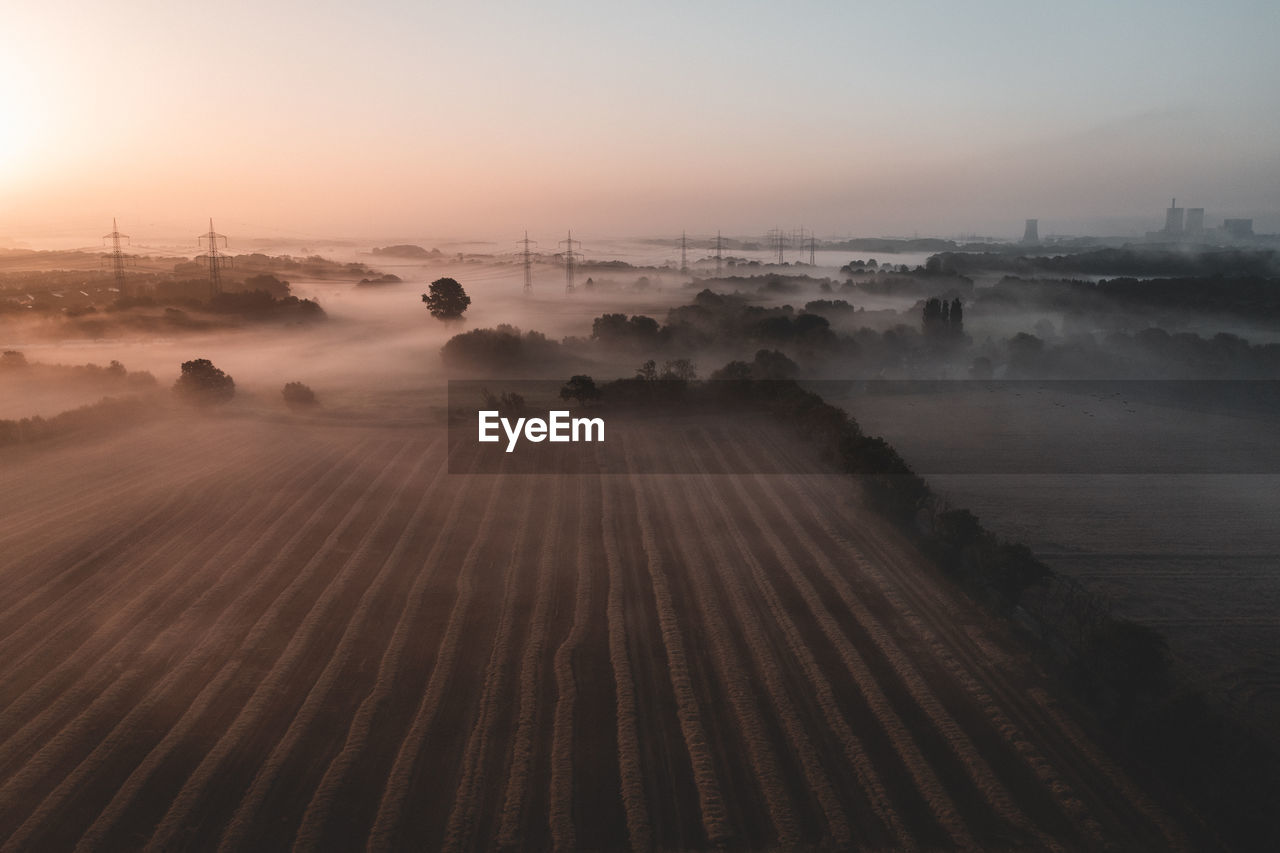 Scenic view of landscape against sky during sunset