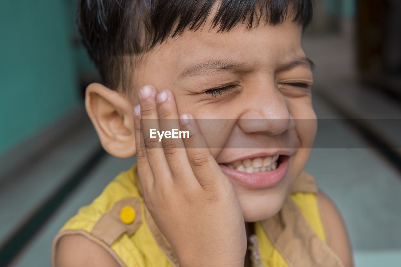 Close-up portrait of boy smiling