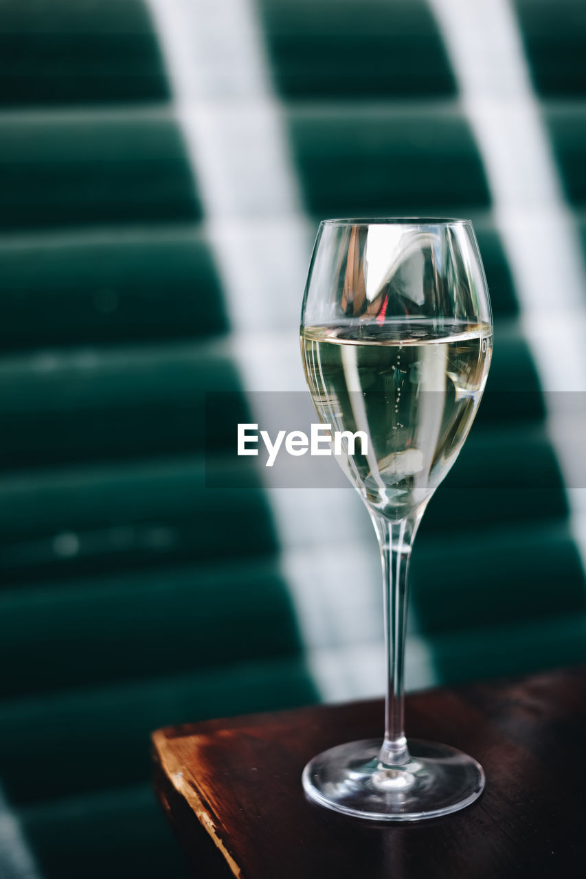 Close-up of wine in glass on table on the street 