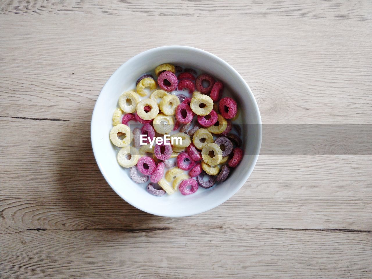 High angle view of breakfast cereal bowl on wooden table