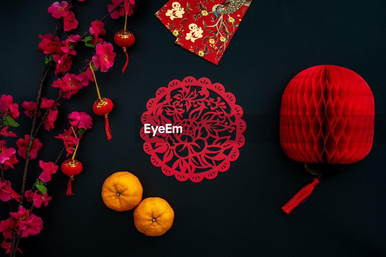 Chinese lunar new year decoration over black background. flat lay concept festive decoration. 