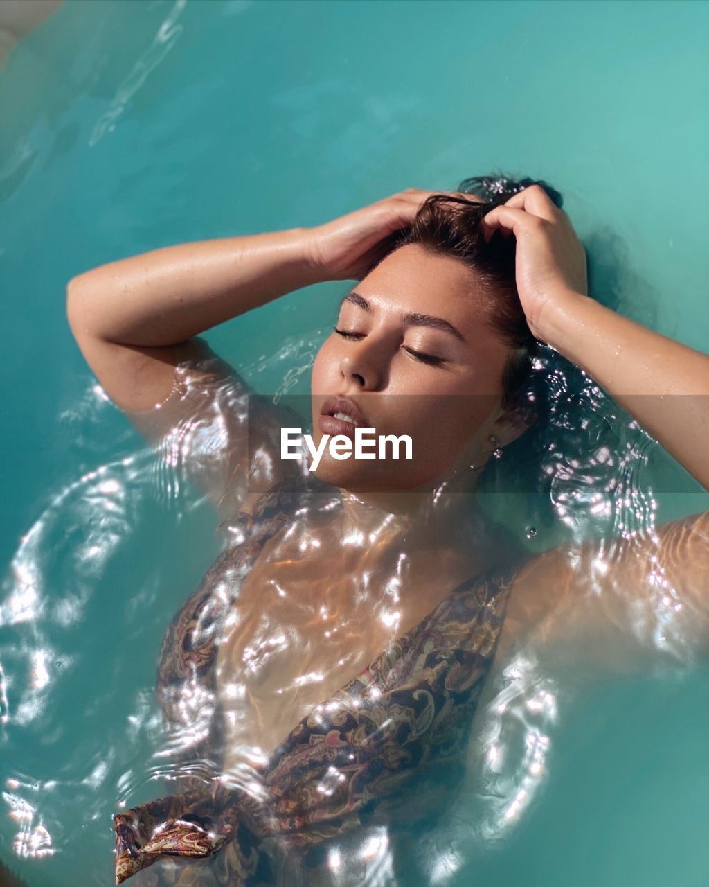 Young woman in swimming pool