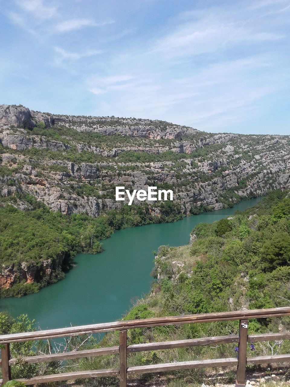 SCENIC VIEW OF RIVER BY LANDSCAPE AGAINST SKY