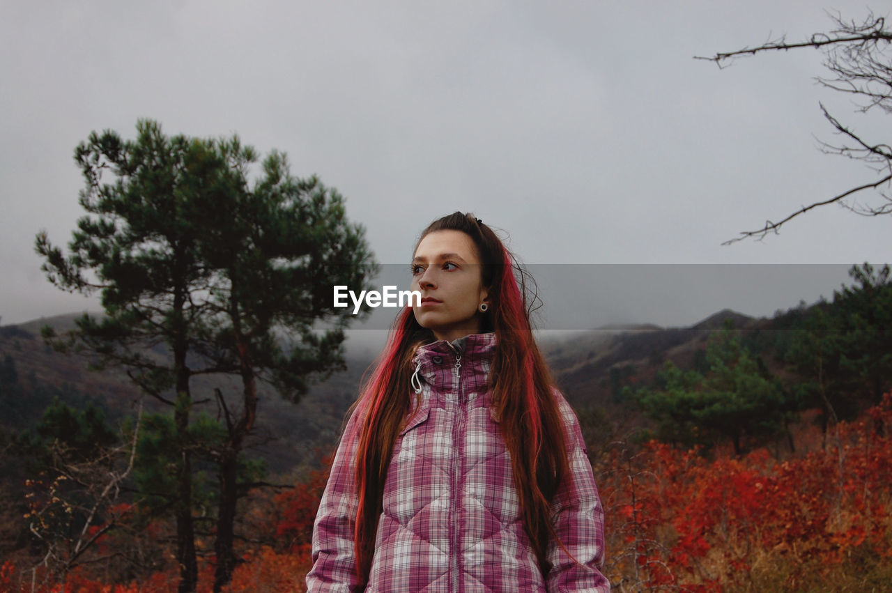 Portrait of young woman in forest