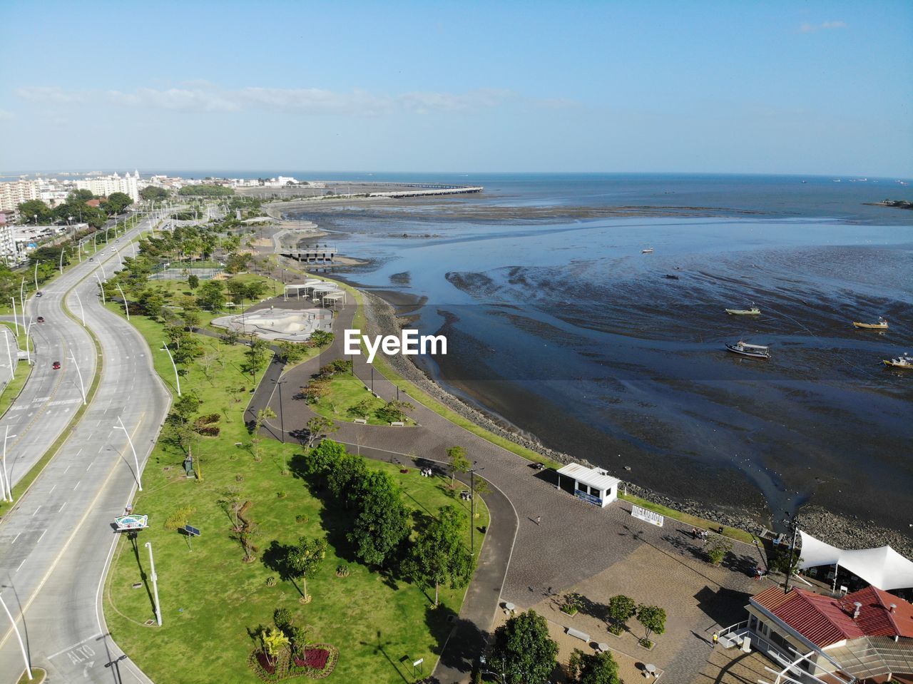 High angle view of road by sea against sky