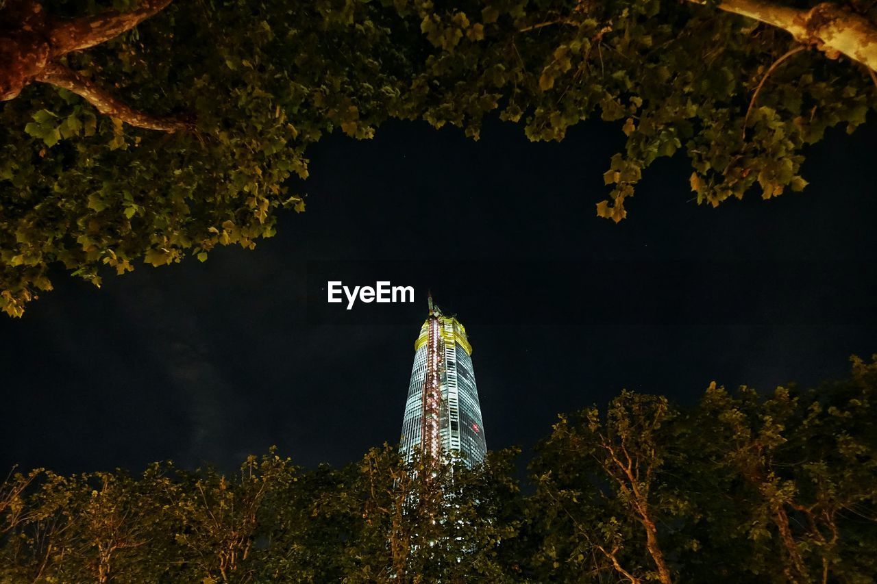 LOW ANGLE VIEW OF ILLUMINATED BUILDING