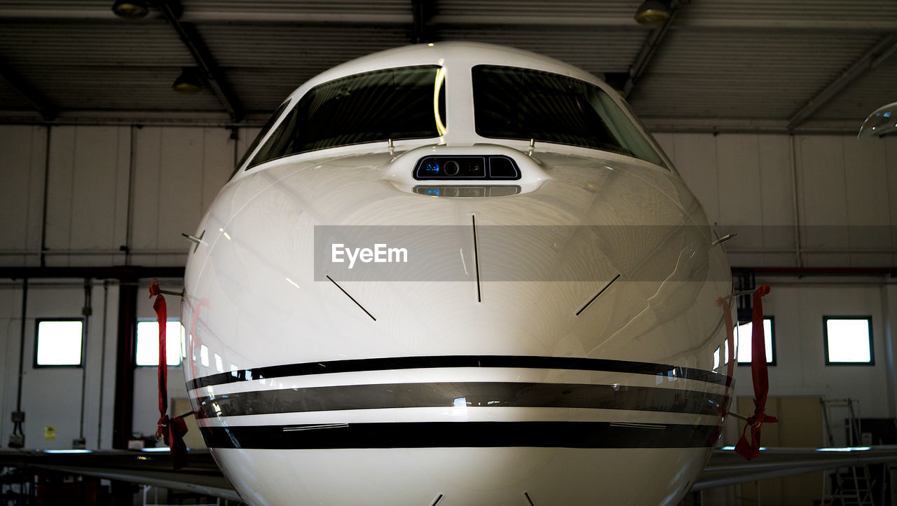 CLOSE-UP OF AIRPLANE IN AIRPORT