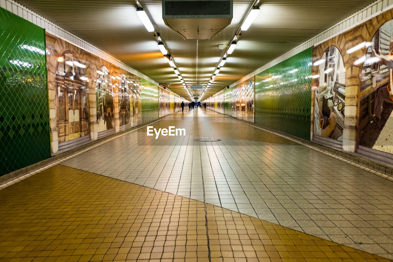 Illuminated pedestrian walkway at subway station