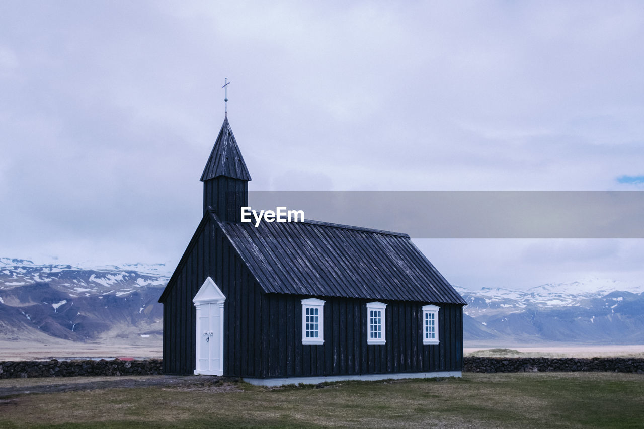 Church on field against sky