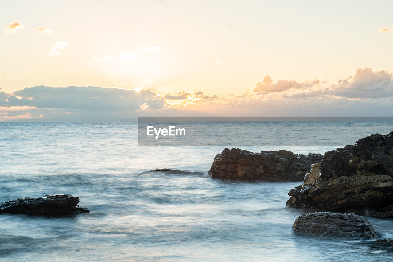 Scenic view of sea against sky during sunset