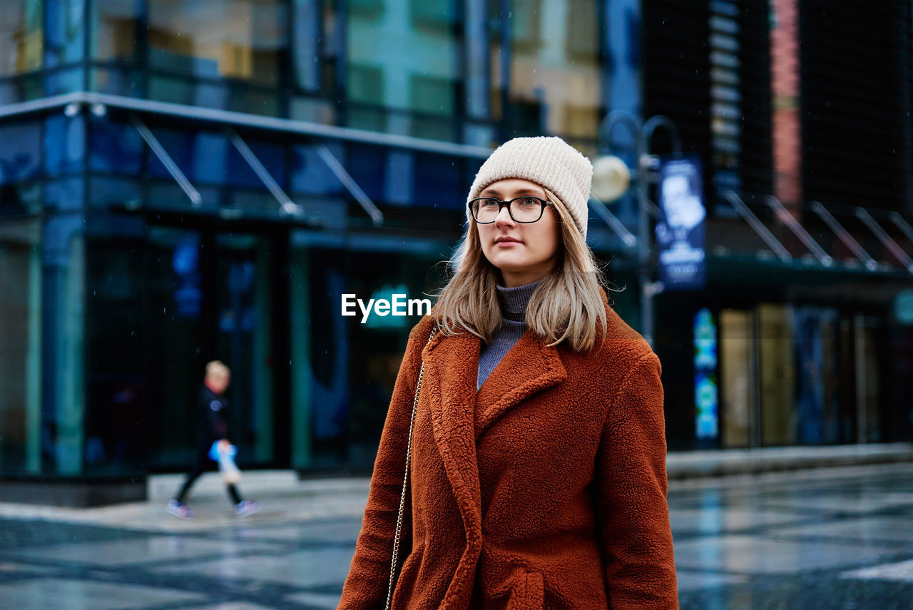 Woman walking at city street