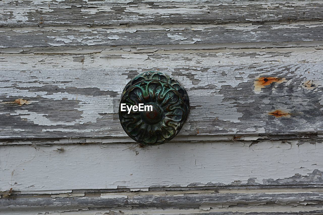 CLOSE-UP VIEW OF PUMPKIN ON STONE WALL