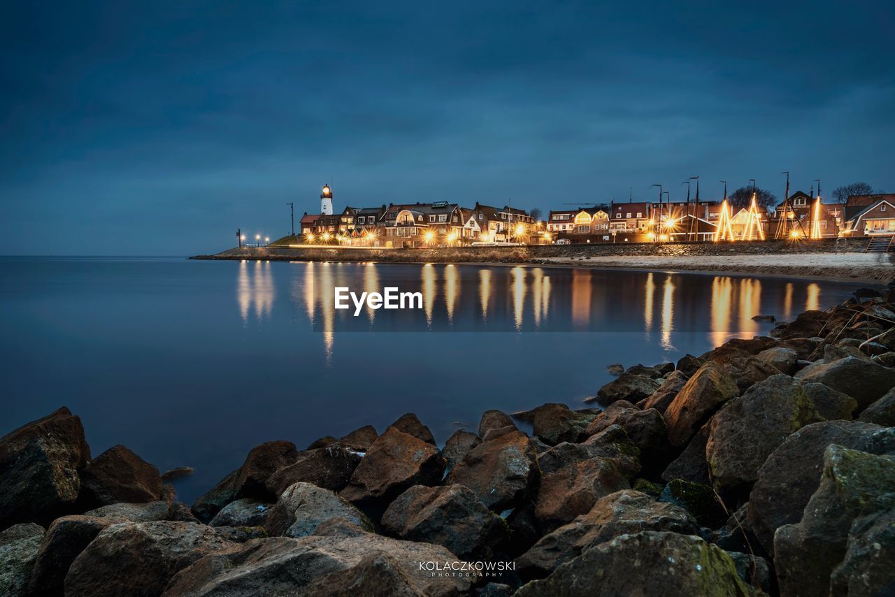 Scenic view of sea against sky at night