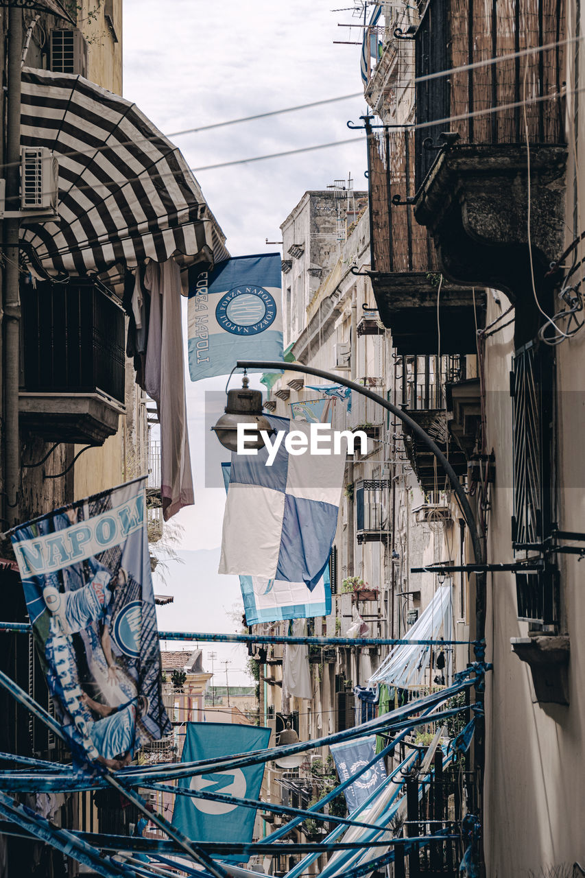 urban area, architecture, built structure, building exterior, blue, street, day, cable, no people, building, city, industry, nature, residential district, outdoors, sky, vehicle