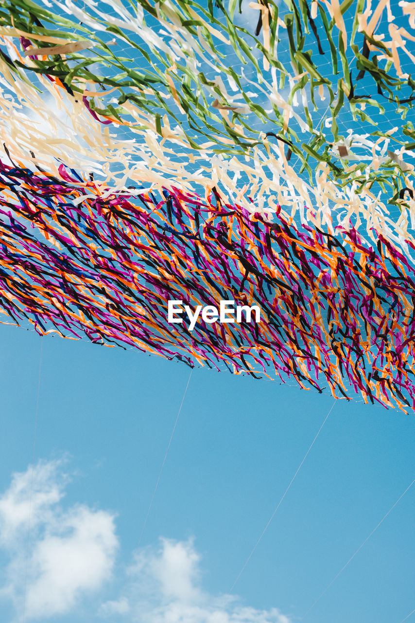 Low angle view of cables against blue sky