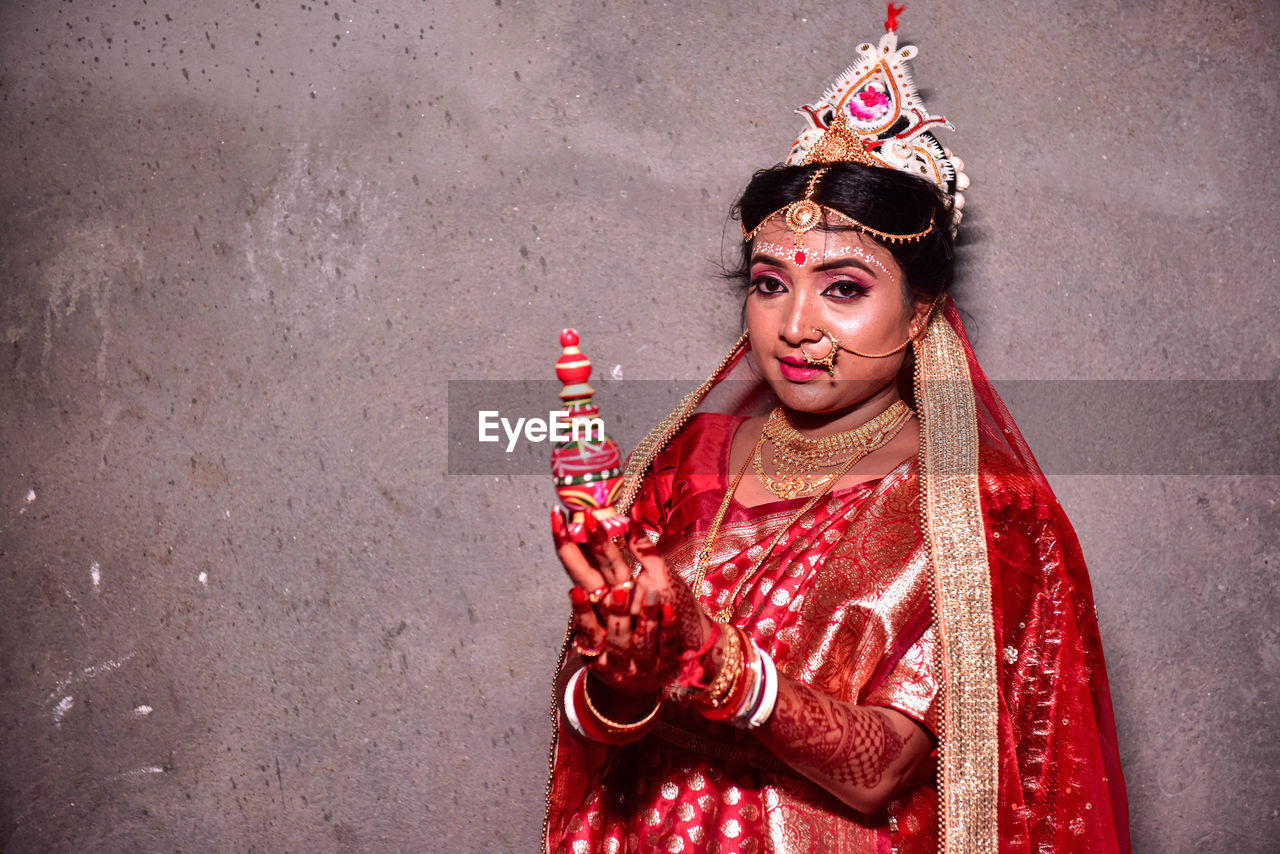 Portrait of young woman  in traditional wedding costume in indian culture 