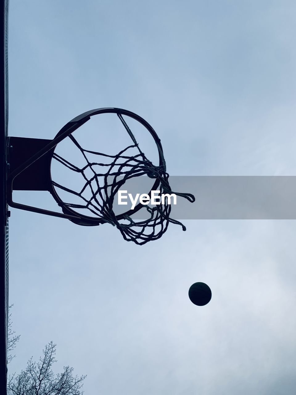 basketball, basketball hoop, sky, sports, blue, ball, low angle view, net - sports equipment, nature, cloud, lighting, no people, street light, playground, silhouette, outdoors